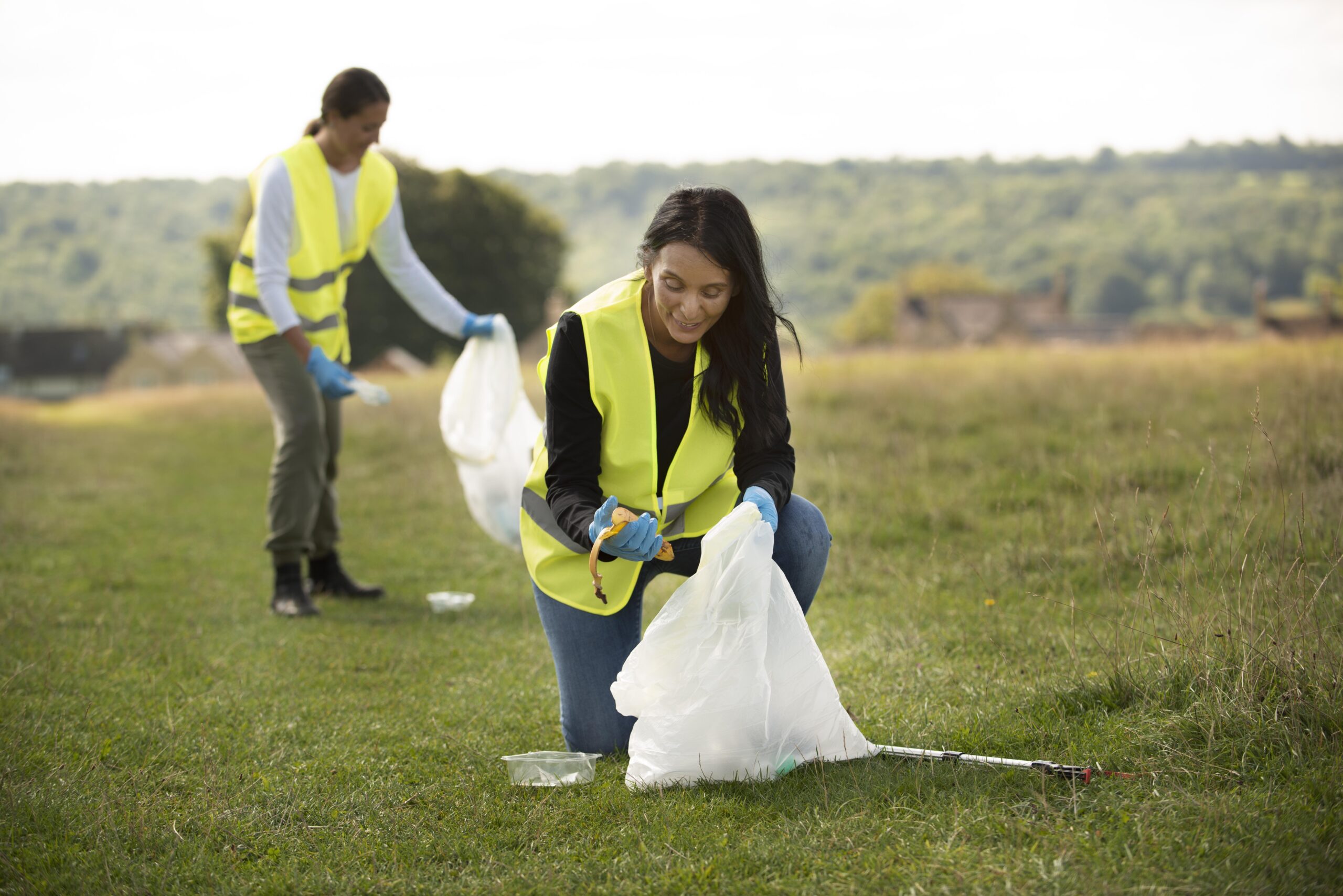 people doing community service by collecting trash